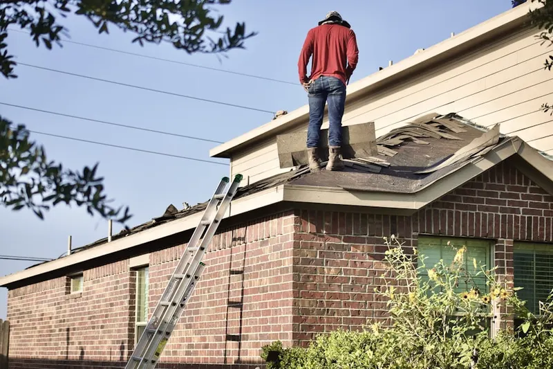 Professional roofer working on a residential roof in San Souci Estates